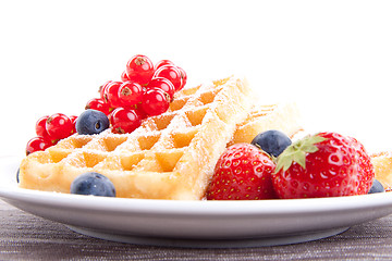 Image showing sweet fresh tasty waffles with mixed fruits isolated
