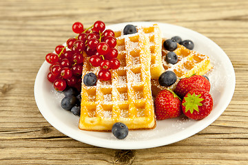 Image showing fresh tasty waffer with powder sugar and mixed fruits