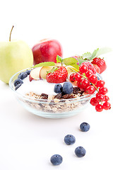 Image showing deliscious healthy breakfast with flakes and fruits isolated