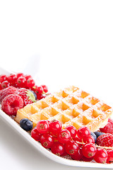 Image showing sweet fresh tasty waffles with mixed fruits isolated