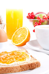 Image showing breakfast table with toast and orange marmelade isolated