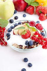 Image showing deliscious healthy breakfast with flakes and fruits isolated