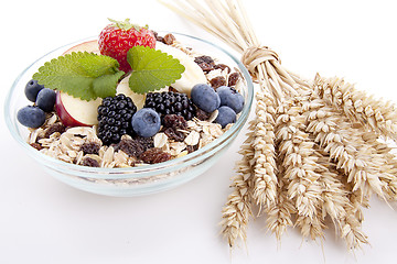 Image showing deliscious healthy breakfast with flakes and fruits isolated