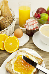 Image showing tasty breackfast with toast and marmelade on table