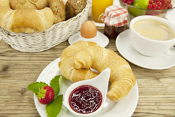 Image showing traditional french breakfast on table in morning