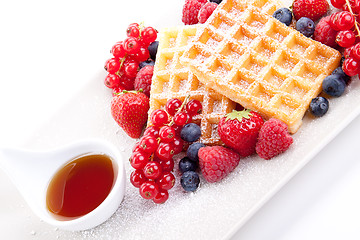 Image showing sweet fresh tasty waffles with mixed fruits isolated