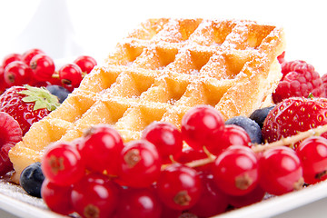 Image showing sweet fresh tasty waffles with mixed fruits isolated