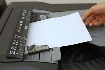 Image showing making copies on the laser copier machine 