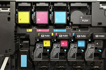 Image showing CMYK ink cartridges for laser copier machine 