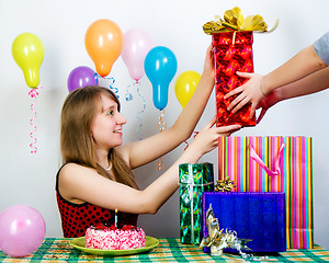 Image showing Birthday. The girl accepts gifts