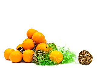 Image showing mandarines and golden balls with green