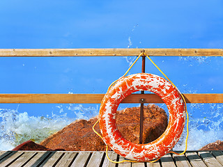 Image showing sea and pier with life buoy