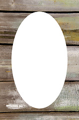 Image showing Abandoned wooden wall and white oval in center 
