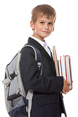 Image showing Boy holding books