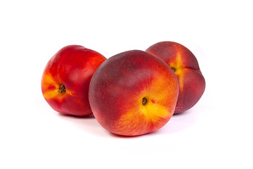 Image showing Three fresh nectarines on white