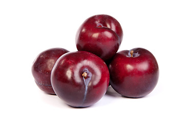 Image showing Group of plums  on white