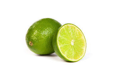 Image showing One whole lime and one half lime on white