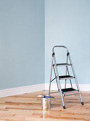 Image showing Renovation project. Ladder and a can of paint in a room