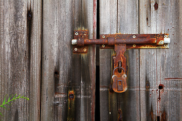 Image showing old lock on closed door