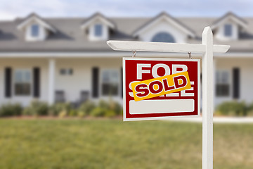 Image showing Red Sold For Sale Real Estate Sign and House