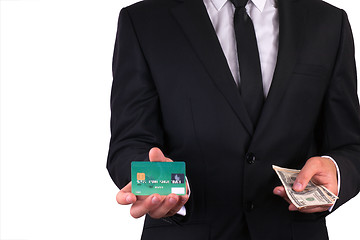 Image showing Businessman with credit card and money