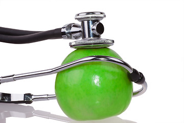 Image showing Stethoscope and apple