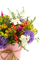 Image showing Summer bouquet of flowers and berries closeup. 