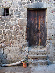 Image showing mediterranean wood door and stone wall, Corsica