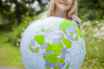 Image showing Girl holding an earth globe