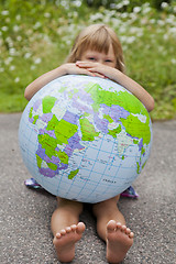 Image showing Girl holding an earth globe