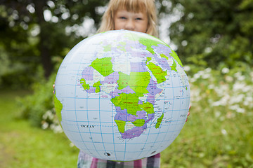 Image showing Girl holding an earth globe