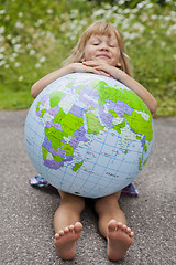 Image showing Girl holding an earth globe