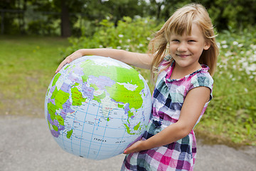 Image showing Girl holding an earth globe