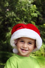 Image showing Happy little boy in Santa hat