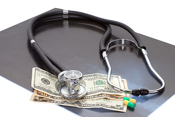 Image showing Stthoscope, dollars and x-ray