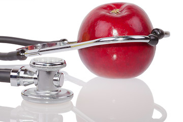 Image showing Stethoscope and apple