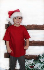 Image showing Little boy in red shirt at Christmas