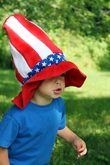 Image showing Little boy wearing big 4th of July hat