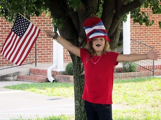 Image showing Pretty girl in 4th of July hat and flag