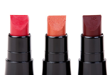 Image showing Three lipstick set in a row