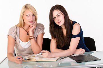 Image showing Two beautiful student girls getting ready for school