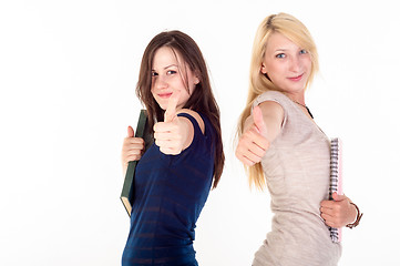 Image showing Two beautiful student girls showing thumbs up