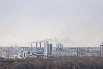 Image showing Tall buildings and forest