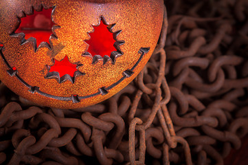 Image showing Orange pumkin on chains