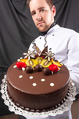 Image showing Confectioner and a cake