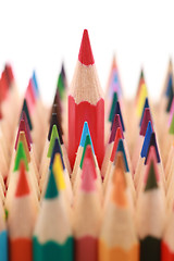 Image showing Red crayon standing out from the crowd