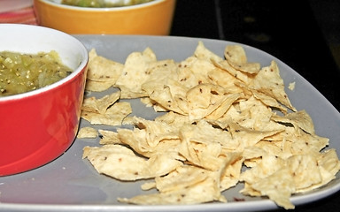 Image showing plates, chips, salsa