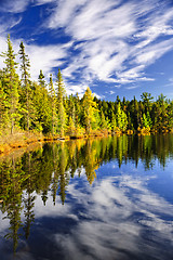 Image showing Forest and sky reflecting in lake