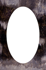 Image showing Old black paint wall and white oval in center 