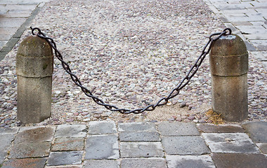 Image showing stone columns with a chain